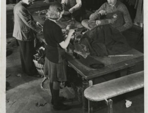 A group of people at work in a textile workshop (source: http://collections.jewishmuseum.cz)