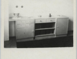 Confiscated apartments of Jewish residents. Sideboard, bookcase, picture on the wall (source: http://collections.jewishmuseum.cz)
